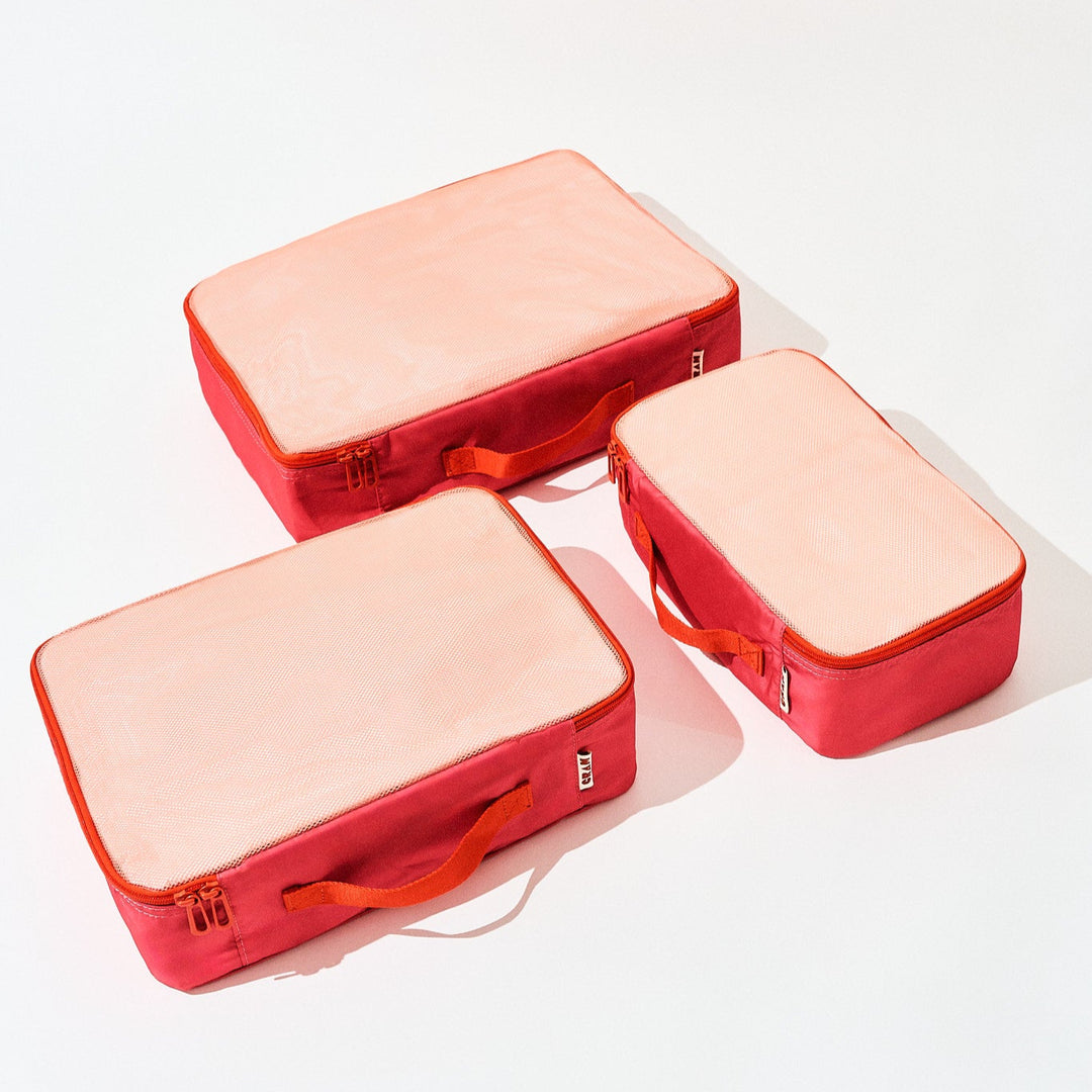 3 sizes of bloom red Cram packing cubes suitcase organizers flat view
