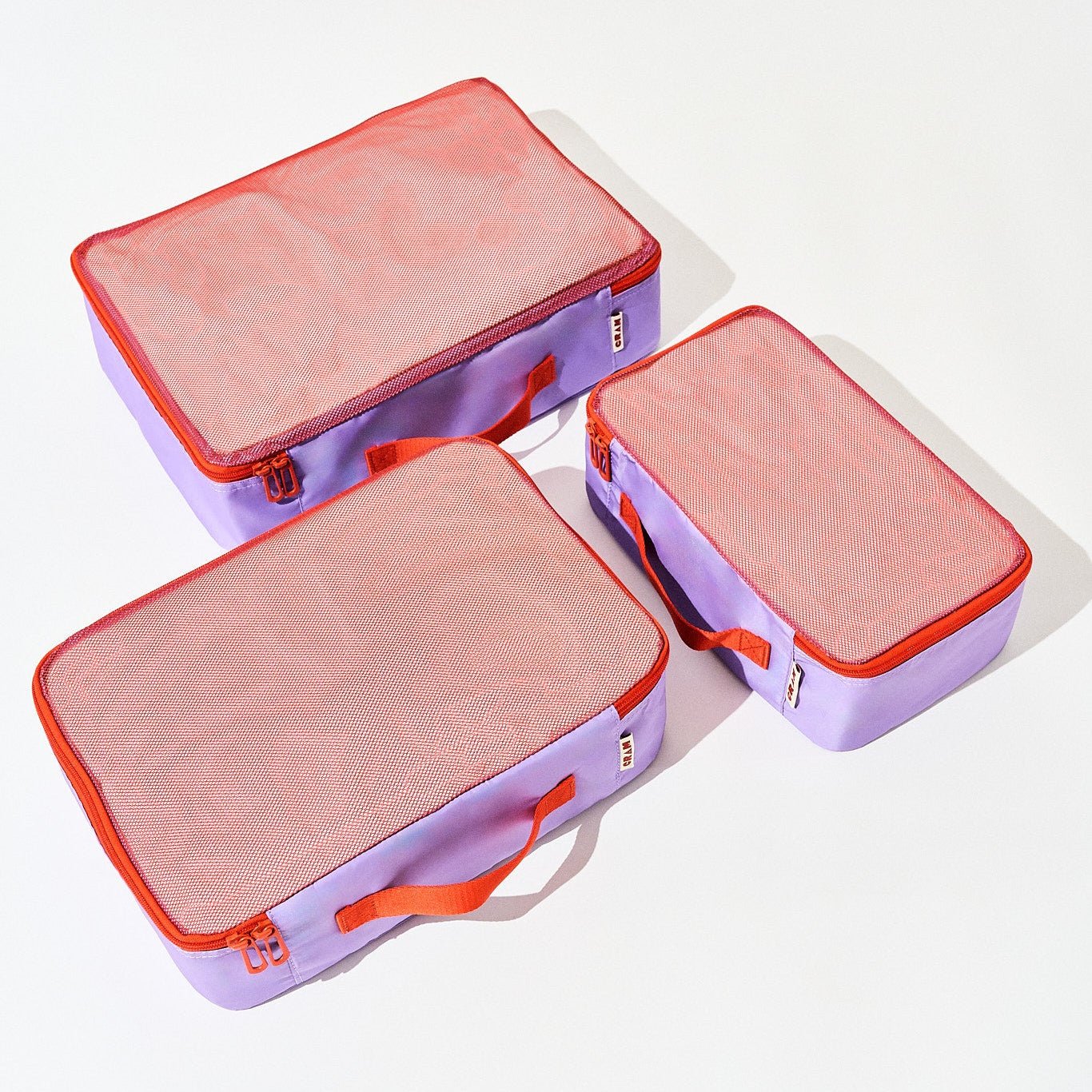 3 sizes of twilight purple Cram packing cubes suitcase organizers flat view