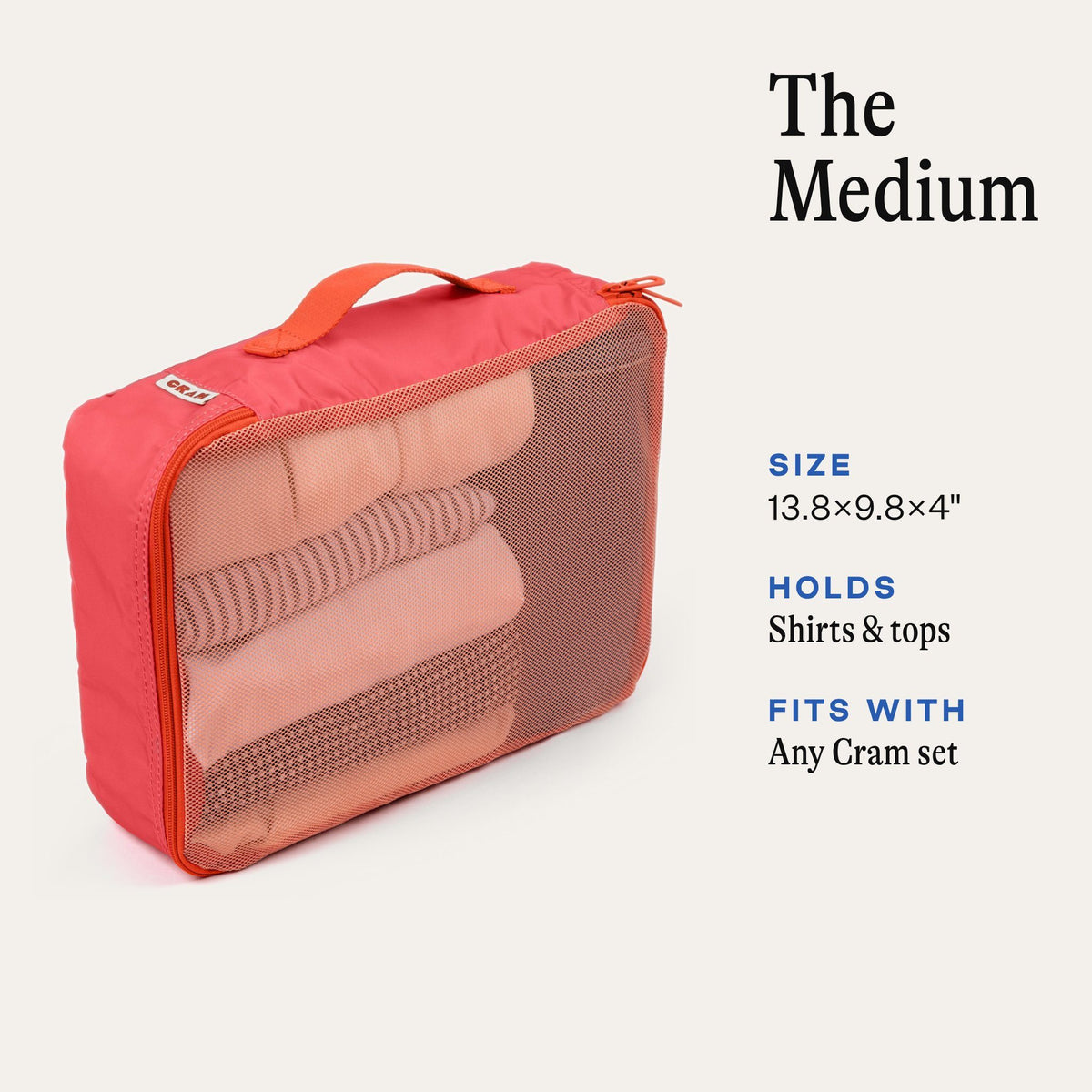 Cram Medium packing cube in Bloom pink with rolled shirts inside. Size 13.8 x 9.8 x 4 inches, holds shirts and tops, fits with any Cram set