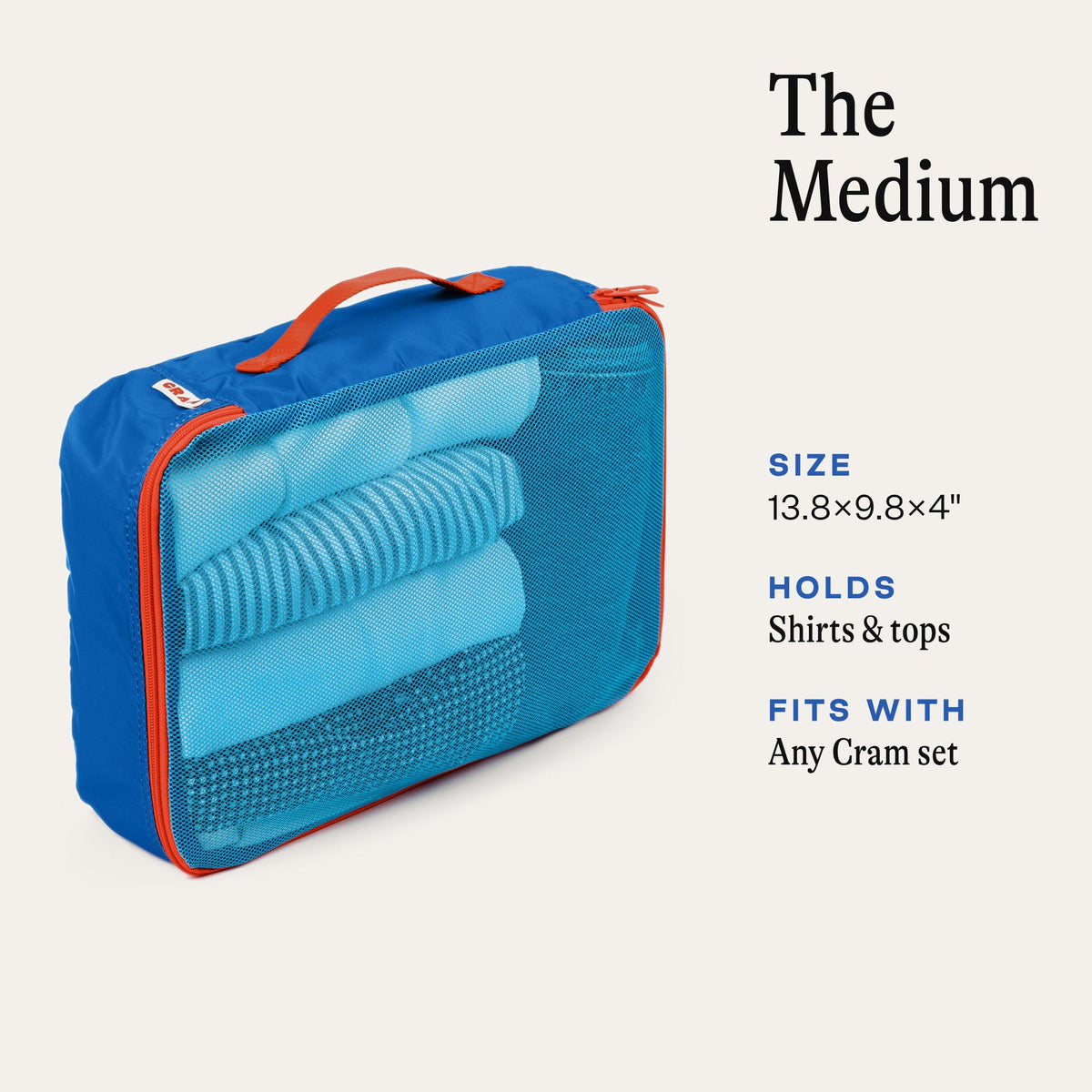 Cram Medium packing cube in Pacific blue with rolled shirts inside. Size 13.8 x 9.8 x 4 inches, holds shirts and tops, fits with any Cram set