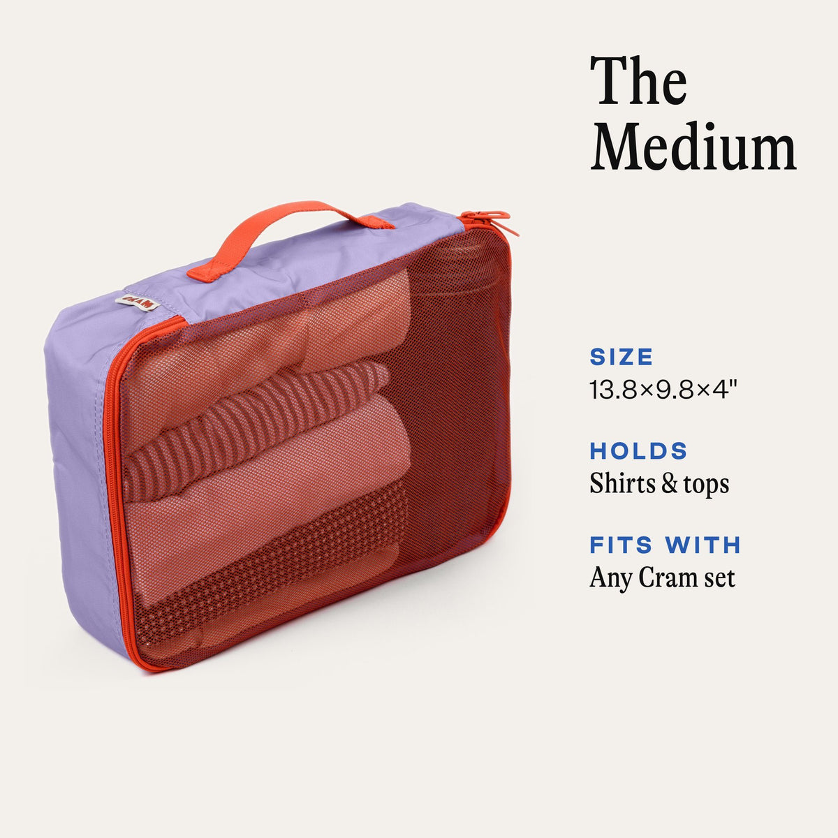 Cram Medium packing cube in Twilight purple with rolled shirts inside. Size 13.8 x 9.8 x 4 inches, holds shirts and tops, fits with any Cram set