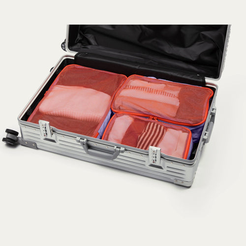 Twilight purple Cram packing cubes packed in an open suitcase